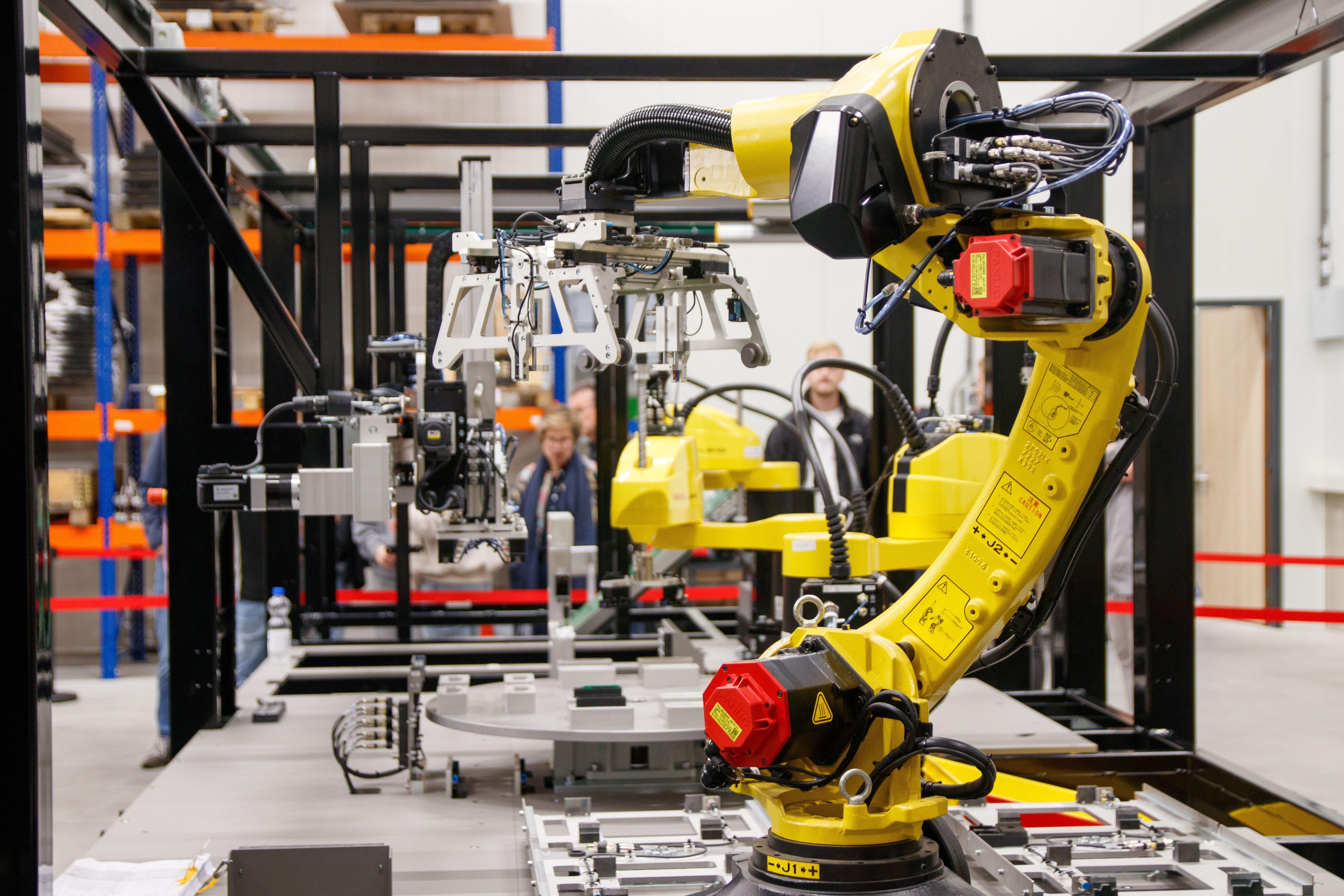 An industrial robot arm working on an automated production cell.