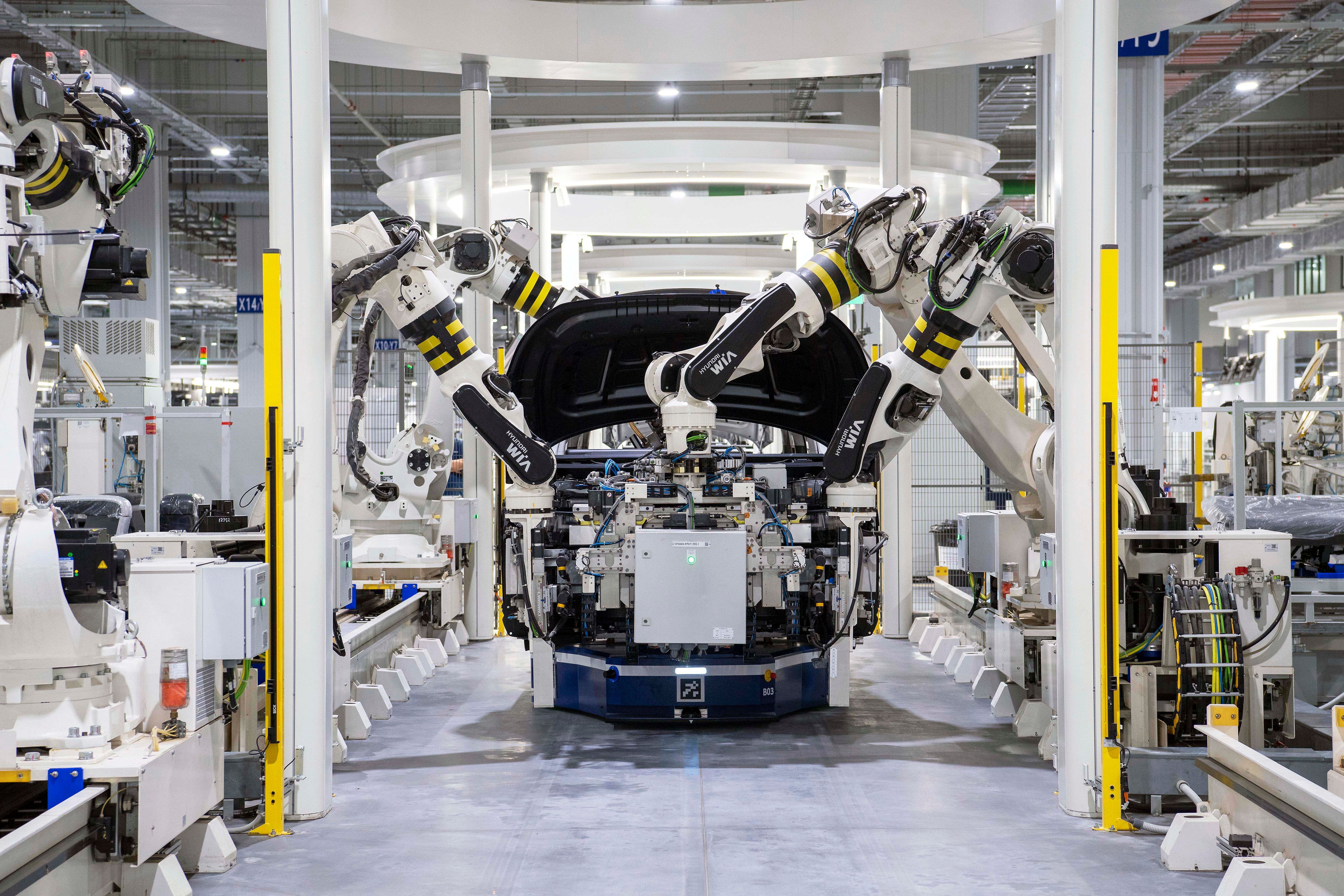 An automated assembly line building a vehicle body.